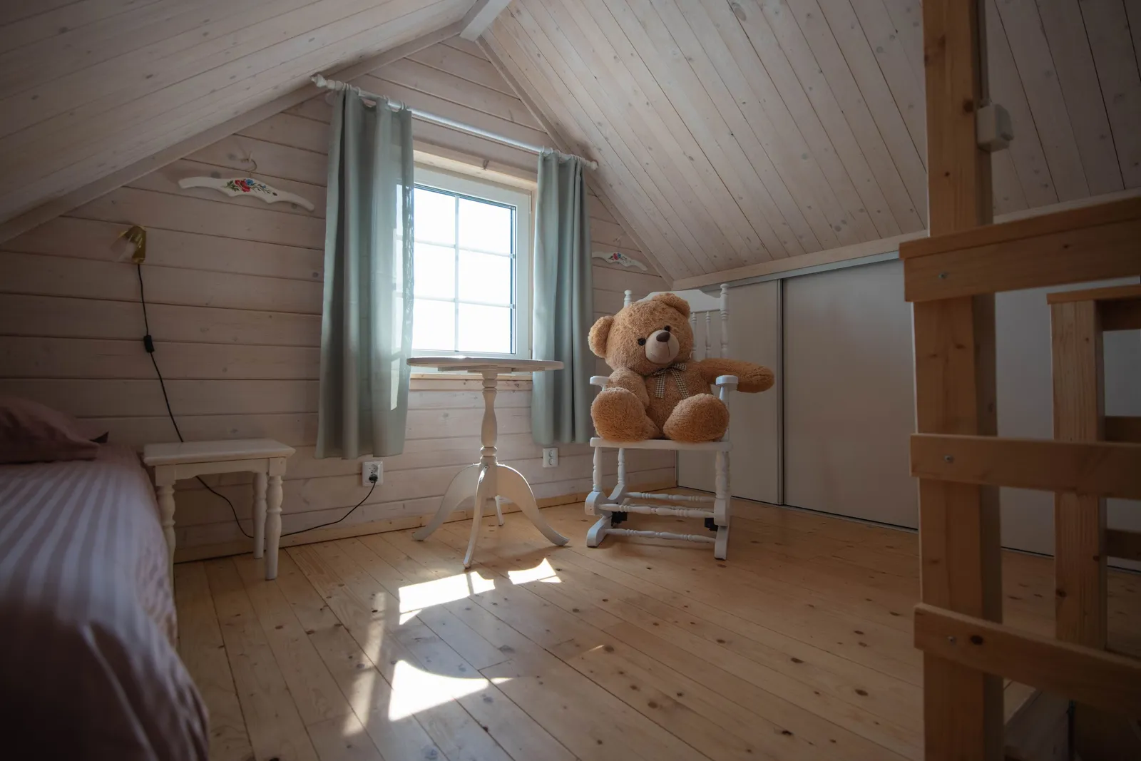 The upstairs bedroom under the sloped roof